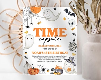 May include: A white card with an orange and black Halloween theme. It says "Time Capsule" and "Sealed Until 2041" with a ghost and spider web design. The text says "To be opened on Noah's 18th Birthday".