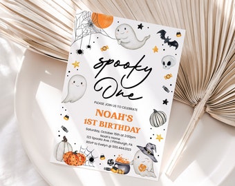 May include: A Halloween-themed invitation with the text "spooky One" in black script. The invitation features illustrations of ghosts, pumpkins, bats, and candy corn. The text "NOAH'S 1ST BIRTHDAY" is in orange. The invitation is on a white background.