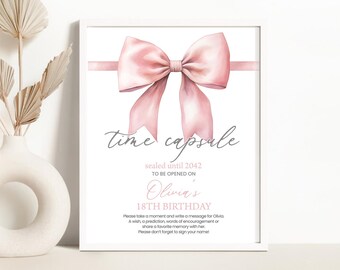 May include: A printable time capsule sign with a pink bow and the text "time capsule", "sealed until 2042", "to be opened on", "Olivia's 18th Birthday". The sign instructs guests to write a message for Olivia, including a wish, prediction, words of encouragement, or a favorite memory. It also asks guests to sign their name.