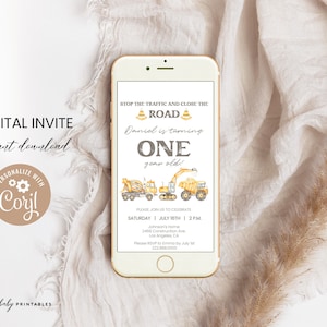 May include: A digital invitation on a smartphone screen. The invitation features construction vehicles, the text "STOP THE TRAFFIC AND CLOSE THE ROAD", and "Daniel is turning ONE year old!" The invitation is for a birthday party.