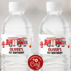 May include: Two clear plastic water bottles with red and white labels featuring a cartoon fire truck and the text "Oliver's 1st Birthday".