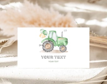 May include: A watercolour illustration of a green tractor with grey wheels and a small chimney. Two balloons are attached to the tractor. The text "YOUR TEXT" is printed below the tractor on a white card.