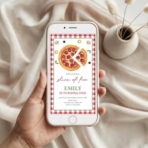 May include: A smartphone displays a pizza-themed birthday invitation. The invitation features a watercolor illustration of a pepperoni pizza with a slice removed, surrounded by olives and mushrooms. Text reads "Join us for a slice of fun, Emily is turning one."