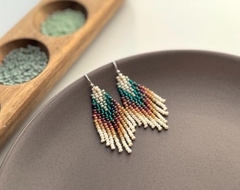 Small boho bead earrings with turquoise brown gradient design and ivory cascading fringe, unique jewelry gift