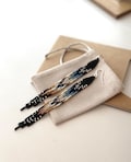 Black Beaded Dangle Earrings – Native Design with Stunning Gradient from Navy Blue to Brown, Boho Chic Handmade Jewelry product logo