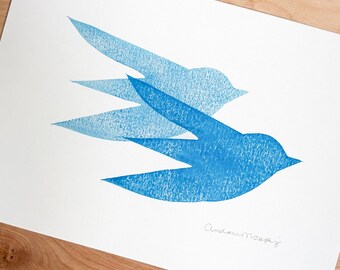 May include: A print depicting three stylized blue birds in flight. The birds are layered, creating a sense of movement against a white background. The artwork is signed in the bottom right corner.