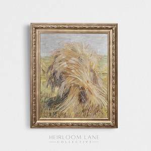 May include: A framed painting depicting a bundle of wheat stalks in a field. The painting is presented in a gold frame with an ornate border. The wheat stalks are a pale yellow colour and are arranged in a casual, natural pattern. The background of the painting is a light blue sky with some clouds.