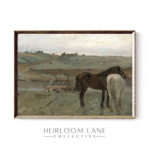 May include: A framed painting of a rural landscape with two horses standing in a field. The horses are brown and white, and they are standing close together. The background of the painting is a rolling green hill with a small village in the distance.