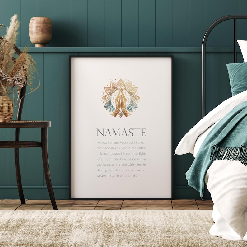May include: A white printable poster featuring a gold and blue mandala design with the word "Namaste" in large, bold lettering. The poster includes a definition of the word "Namaste" in smaller text.