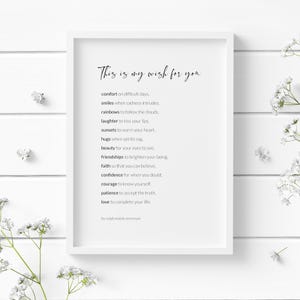 May include: A white framed print with a black and white poem that reads "This is my wish for you" and lists a series of wishes for comfort, smiles, rainbows, laughter, sunsets, hugs, beauty, friendships, faith, confidence, courage, patience, and love. The poem is attributed to Ralph Waldo Emerson.