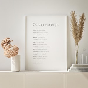 May include: A white framed print with a black and white text quote that reads "This is my wish for you" and lists a series of wishes, ending with "by ralph waldo emerson".