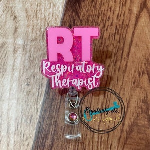 May include: Pink glitter badge holder with a pink "RT Respiratory Therapist" text and a clear retractable badge reel with a pink rhinestone.