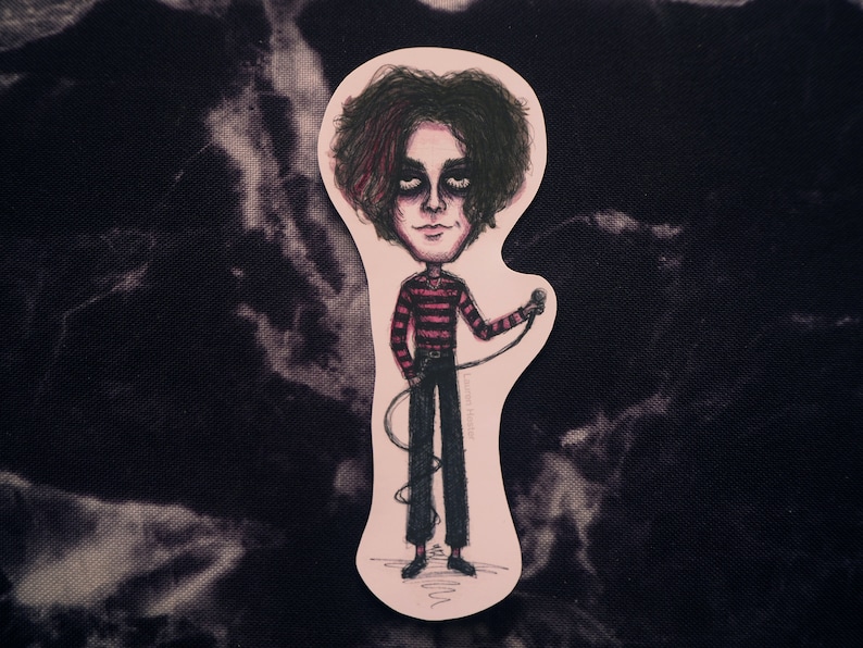 May include: A sticker of a cartoon illustration of a person with dark hair and a red and black striped shirt holding a microphone. The person is standing on a pink background.