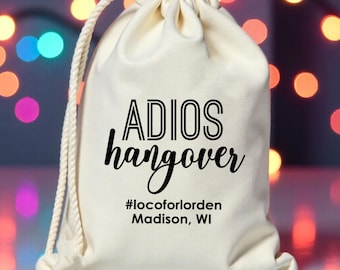 May include: White drawstring bag with the text "ADIOS hangover #locoforlorden Madison, WI" printed in black.