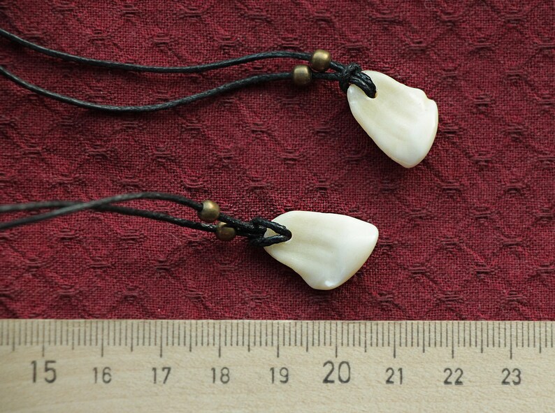 Pendant of Red Deer fang .