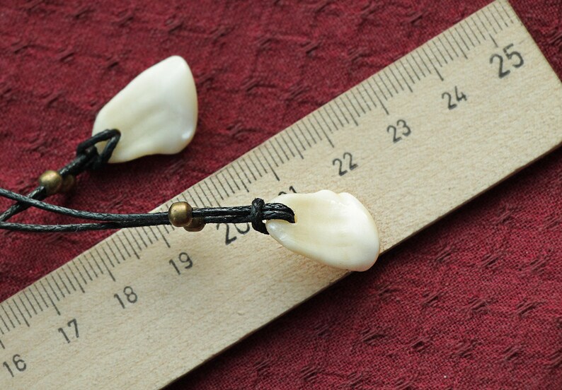Pendant of Red Deer fang .