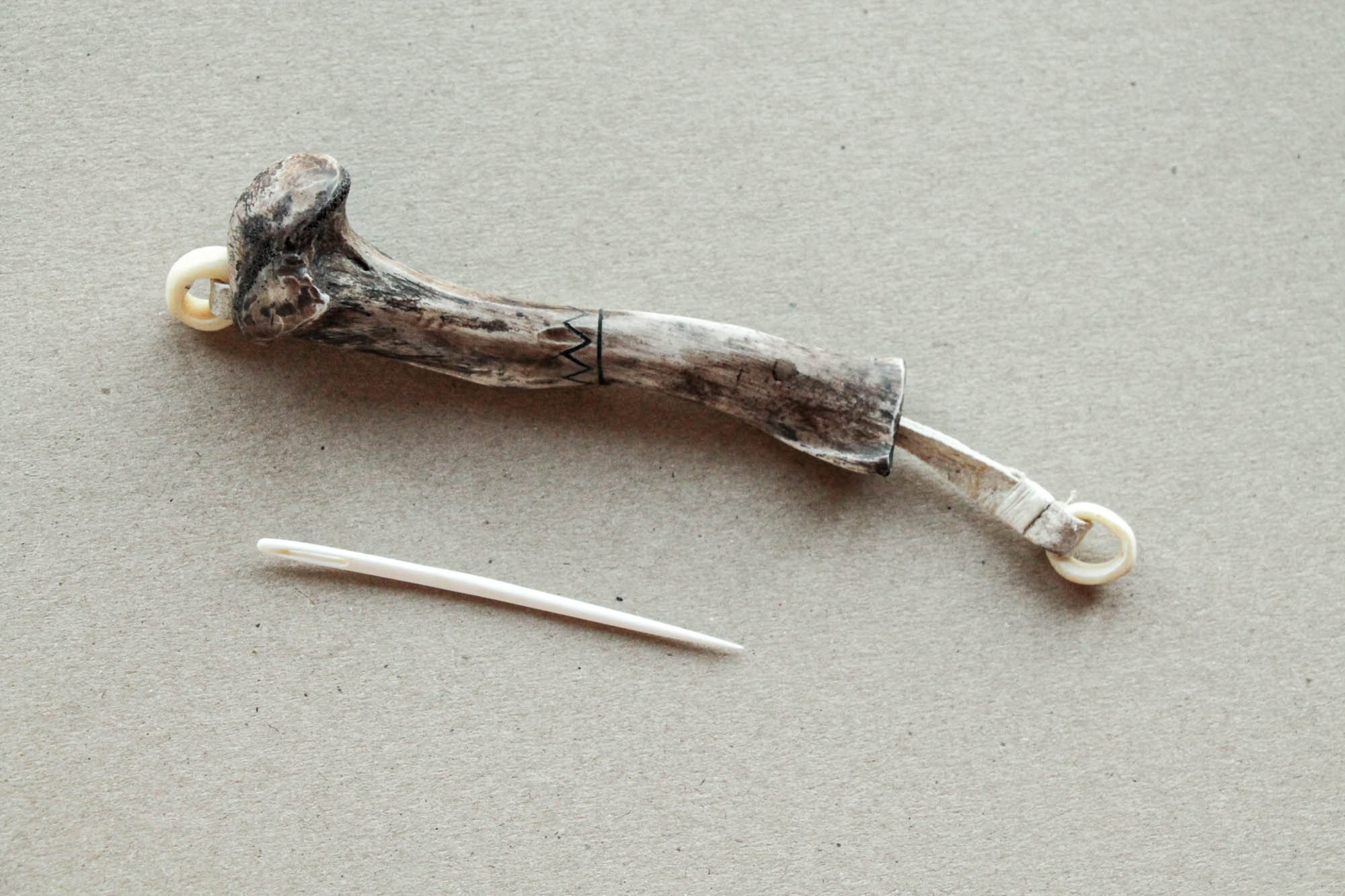 The needle from bones of the wolverine in a bone case