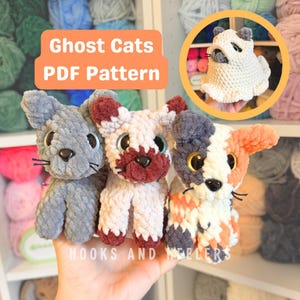 May include: Three handmade crochet cat toys in grey, white, and calico patterns, each with large eyes and small whiskers. A smaller, white ghost cat toy is in a circular inset. The text "Ghost Cats PDF Pattern" is displayed.