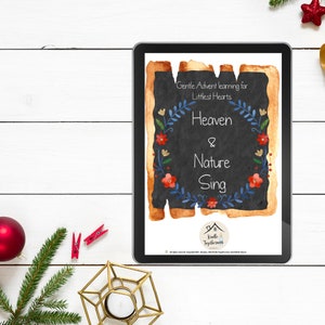 May include: A digital tablet displaying a printable for a children's Advent learning activity. The title is "Heaven & Nature Sing" with a watercolor background and floral accents. The text "Gentle Advent learning for Littlest Hearts" is also included.