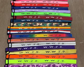 100 WWJD ¿Qué haría Jesús? Pulseras tejidas Pulseras Nuevos colores Lote a granel Joyería religiosa cristiana Vendedor de calidad genuina Bandas de oración