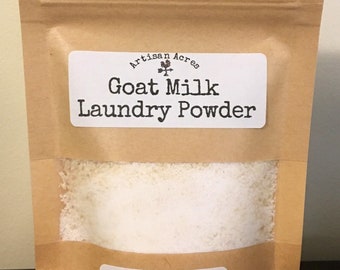 May include: A brown paper bag with a white label that says "Artisan Acres Goat Milk Laundry Powder". The label also says "Sample Pack 5 Loads Included 1 Tablespoon = 1 Load".