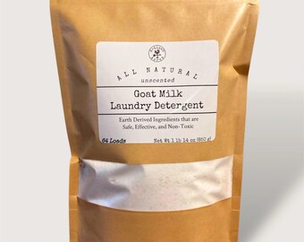 May include: A brown paper bag of unscented goat milk laundry detergent. The white label reads "ALL NATURAL" and "Goat Milk Laundry Detergent." The bag contains 1 lb 14 oz (850 g) of detergent, enough for 64 loads.