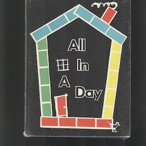 May include: A black book cover featuring a colourful house illustration. The house has a red chimney, a red door, and a yellow, green, and blue brick pattern. The text "All In A Day" is written in white letters on the cover.