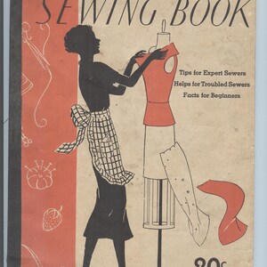 May include: A vintage Simplicity Sewing Book cover with a black and white illustration of a woman sewing a dress on a dress form. The cover is red, white, and black with the text "SIMPLICITY SEWING BOOK" in large, bold letters. The text "Tips for Expert Sewers, Helps for Troubled Sewers, Facts for Beginners" is printed below the title. The price "20c" is printed in the bottom right corner. The text "YOU ARE ALWAYS IN STYLE WHEN YOU DRESS WITH SIMPLICITY" is printed at the bottom of the cover.