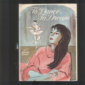 May include: A book cover with the title "To Dance, To Dream" by Maxine Drury. The cover features a watercolour illustration of a young woman in a pink dress looking up and a ballerina in a pink tutu dancing in the background.