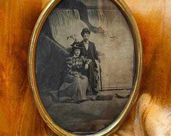 Antique Couple Photographed With Waterfalls In Metal Oval Frame