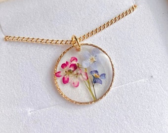 Forget me not and Alyssum real flowers preserved in a gold filled circle necklace. On a gold filled or gold plated chain. Christmas gift