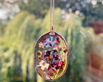 Real pressed flower necklace. Miniature forest garden jewellery , dried flowers preserved In silver with a silver chain.