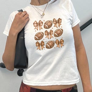 Football Coquette Bow Baby Tee Cute Top Aesthetic Y2k Tshirt Trendy Bow Ribbon Cute Baby Tee Woman&#39;s Top Bow Print Baby Tee Bow Lover Gift