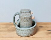 Handmade salt and pepper shakers with caddy