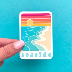 Sticker strand zonsondergang aan zee