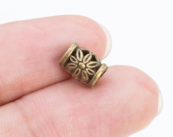 40 cuentas espaciadoras en forma de tubo con forma de flor, 9 x 6 mm, tono bronce antiguo (65101-2522)