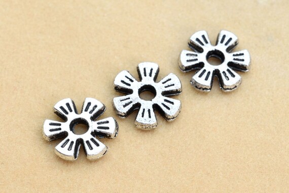 500 perline distanziatrici a forma di fiore in argento antico - 4 mm