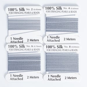 May include: Four spools of gray 100% silk thread for stringing pearls and beads. Each spool has a needle attached and contains 2 meters of thread. The thread diameters are 0.45mm, 0.60mm, 0.70mm, and 0.80mm.