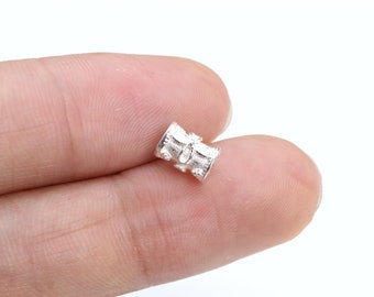 May include: Silver bead with an intricate design, ideal for jewellery making or adding a touch of elegance to your projects.