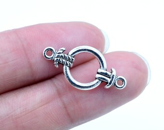 May include: Silver-toned metal clasp with a rope design and a circular opening. The clasp is designed for jewelry making.