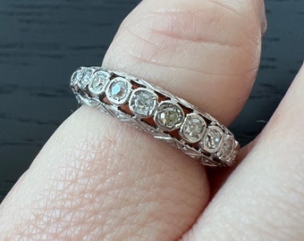 Antique platinum diamond and filagree eternity band