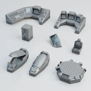 May include: A selection of grey, futuristic control panels, consoles, and seating. The set includes various shapes and sizes, with detailed textures and geometric patterns. The pieces appear to be components of a larger, complex system.