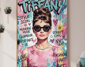 May include: A framed pop art print featuring a portrait of a woman wearing sunglasses and a pearl necklace. The artwork includes the word "Tiffany" in graffiti style, along with other text and colorful accents. The overall theme is fashion and street art.