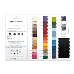 May include: A fabric swatch card featuring a variety of colors and textures. The card includes a black swatch and a range of colors, including beige, brown, red, and blue. Text in Italian reads "Finta Pelle Morbida".