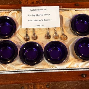 6 Cobalt glass salt cellars in sterling holder with original sterling salt spoons (5) in original box