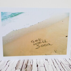 Passer le message bien bientôt en sable carte de souhaits