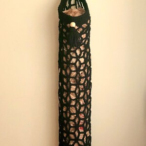 Crochet grocery bag holder pattern in beautiful boho crochet design. This functional boho bag saver will look great as crochet wall decor and function as a crochet organizer.