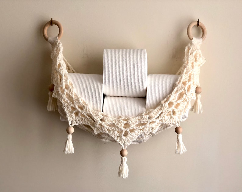 Crochet hammock pattern works as a crochet wall hanging, crochet fruit holder, or crochet home decor organizer. The lacy crochet stitch design makes this pattern both fashionable and functional.