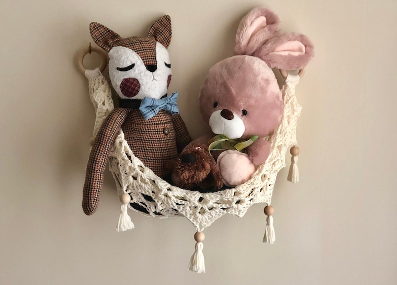 Crochet hammock pattern works as a crochet wall hanging, crochet fruit holder, or crochet home decor organizer. The lacy crochet stitch design makes this pattern both fashionable and functional.