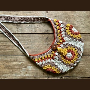 Crochet fanny pack pattern also a crossbody bag or shoulder bag. Single crochet strap with tassel. This Boho Bag pattern features beautiful crochet sunburst motif.